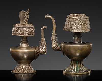 Lot 151 - A GROUP OF TWO METAL REPOUSSÉ CEREMONIAL EWERS, BUMPA