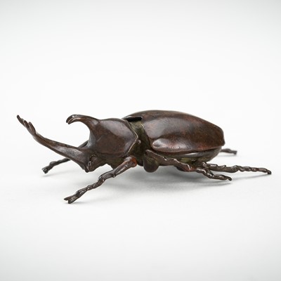 Lot 1456 - A COPPER ALLOY OKIMONO OF A RHINO BEETLE