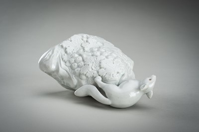 Lot 187 - A HIRADO WHITE-GLAZED PORCELAIN OKIMONO OF A SQUIRREL AND GRAPES
