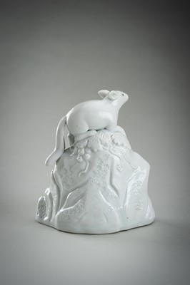 Lot 187 - A HIRADO WHITE-GLAZED PORCELAIN OKIMONO OF A SQUIRREL AND GRAPES
