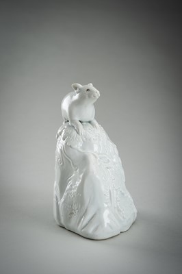 Lot 187 - A HIRADO WHITE-GLAZED PORCELAIN OKIMONO OF A SQUIRREL AND GRAPES