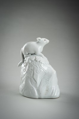 Lot 187 - A HIRADO WHITE-GLAZED PORCELAIN OKIMONO OF A SQUIRREL AND GRAPES
