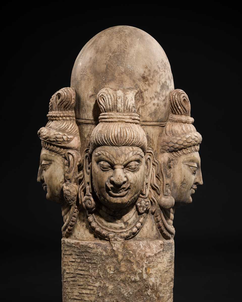 Lot 65 - A WHITE MARBLE CHATURMUKHA LINGAM, 8TH-10TH CENTURY