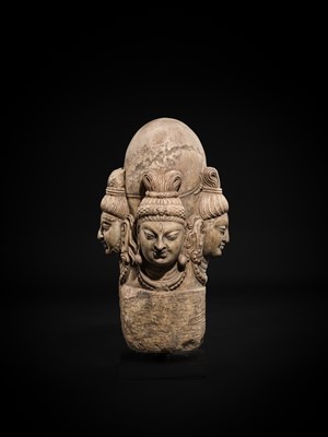 Lot 65 - A WHITE MARBLE CHATURMUKHA LINGAM, 8TH-10TH CENTURY
