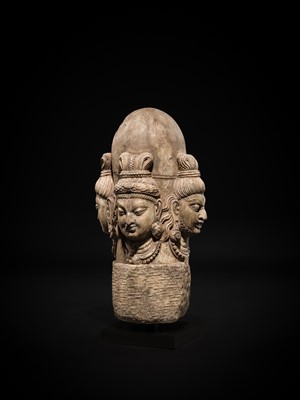 Lot 65 - A WHITE MARBLE CHATURMUKHA LINGAM, 8TH-10TH CENTURY