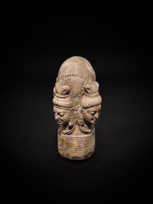 Lot 65 - A WHITE MARBLE CHATURMUKHA LINGAM, 8TH-10TH CENTURY
