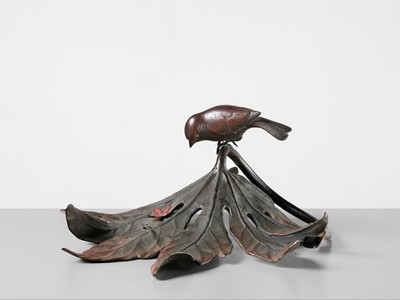 Lot 68 - A FINE BRONZE OKIMONO OF A SPARROW ON AN ARALIA LEAF