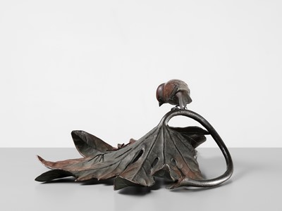 Lot 68 - A FINE BRONZE OKIMONO OF A SPARROW ON AN ARALIA LEAF