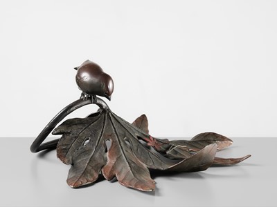 Lot 68 - A FINE BRONZE OKIMONO OF A SPARROW ON AN ARALIA LEAF