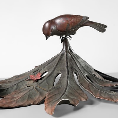 Lot 68 - A FINE BRONZE OKIMONO OF A SPARROW ON AN ARALIA LEAF