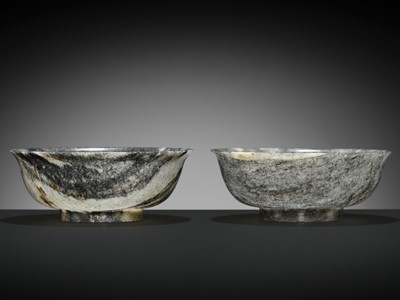 A RARE PAIR OF BLACK AND WHITE NEPHRITE JADE STRIATED BOWLS, QIANLONG MARK AND PERIOD