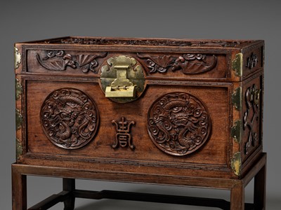 Lot 117 - A LARGE HUANGHUALI WOOD CHEST AND STAND, 1900s