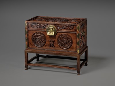 Lot 117 - A LARGE HUANGHUALI WOOD CHEST AND STAND, 1900s