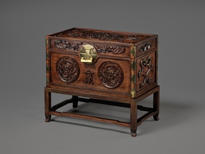 Lot 117 - A LARGE HUANGHUALI WOOD CHEST AND STAND, 1900s