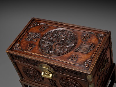 Lot 117 - A LARGE HUANGHUALI WOOD CHEST AND STAND, 1900s