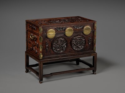 Lot 117 - A LARGE HUANGHUALI WOOD CHEST AND STAND, 1900s