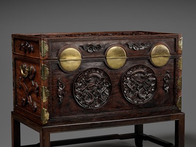 Lot 117 - A LARGE HUANGHUALI WOOD CHEST AND STAND, 1900s