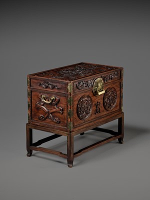 Lot 117 - A LARGE HUANGHUALI WOOD CHEST AND STAND, 1900s