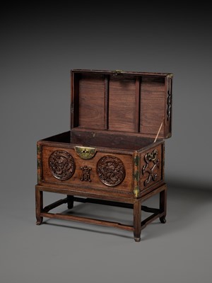 Lot 117 - A LARGE HUANGHUALI WOOD CHEST AND STAND, 1900s