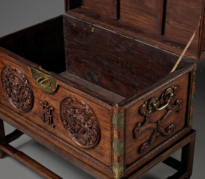 Lot 117 - A LARGE HUANGHUALI WOOD CHEST AND STAND, 1900s