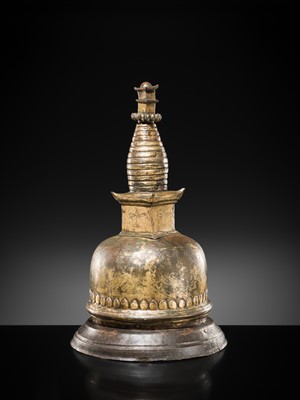 Lot 117 - A GILT COPPER ALLOY RELIQUARY SVAYAMBHU STUPA, NEPAL, 17TH-18TH CENTURY