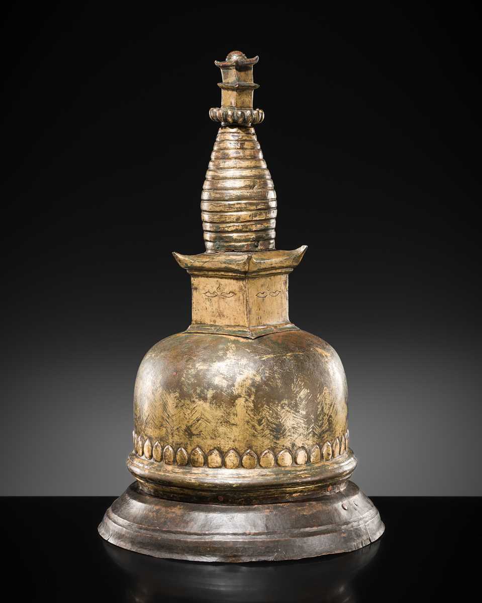 Lot 117 - A GILT COPPER ALLOY RELIQUARY SVAYAMBHU STUPA, NEPAL, 17TH-18TH CENTURY