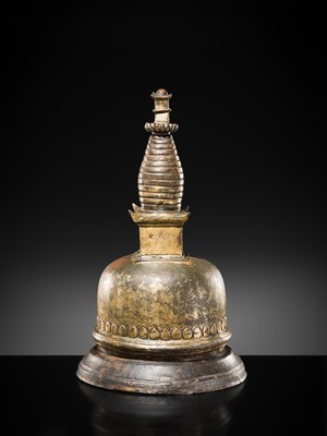 Lot 117 - A GILT COPPER ALLOY RELIQUARY SVAYAMBHU STUPA, NEPAL, 17TH-18TH CENTURY