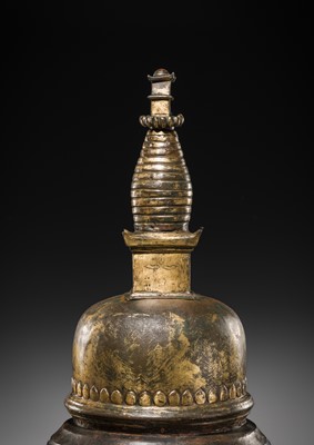 Lot 117 - A GILT COPPER ALLOY RELIQUARY SVAYAMBHU STUPA, NEPAL, 17TH-18TH CENTURY