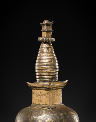 Lot 117 - A GILT COPPER ALLOY RELIQUARY SVAYAMBHU STUPA, NEPAL, 17TH-18TH CENTURY