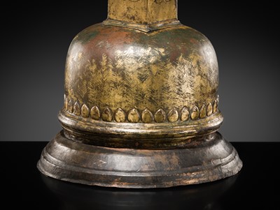 Lot 117 - A GILT COPPER ALLOY RELIQUARY SVAYAMBHU STUPA, NEPAL, 17TH-18TH CENTURY