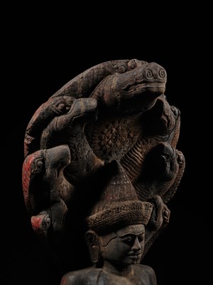 Lot 40 - A MONUMENTAL (215 CM HIGH) AND IMPORTANT WOOD SCULPTURE OF BUDDHA MUCHALINDA, POST-ANGKORIAN PERIOD