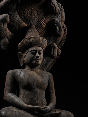 Lot 40 - A MONUMENTAL (215 CM HIGH) AND IMPORTANT WOOD SCULPTURE OF BUDDHA MUCHALINDA, POST-ANGKORIAN PERIOD