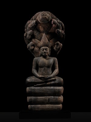 Lot 40 - A MONUMENTAL (215 CM HIGH) AND IMPORTANT WOOD SCULPTURE OF BUDDHA MUCHALINDA, POST-ANGKORIAN PERIOD