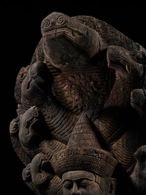 Lot 40 - A MONUMENTAL (215 CM HIGH) AND IMPORTANT WOOD SCULPTURE OF BUDDHA MUCHALINDA, POST-ANGKORIAN PERIOD