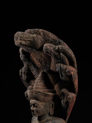 Lot 40 - A MONUMENTAL (215 CM HIGH) AND IMPORTANT WOOD SCULPTURE OF BUDDHA MUCHALINDA, POST-ANGKORIAN PERIOD