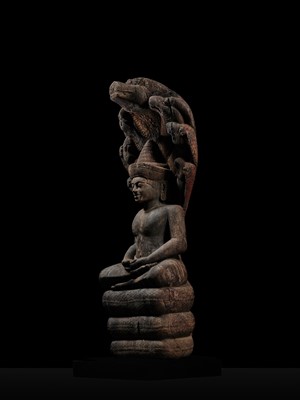 Lot 40 - A MONUMENTAL (215 CM HIGH) AND IMPORTANT WOOD SCULPTURE OF BUDDHA MUCHALINDA, POST-ANGKORIAN PERIOD