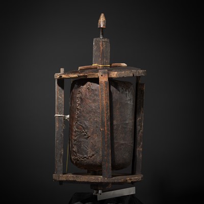 Lot 186 - A LARGE BROWN-LEATHER AND WOOD PRAYER WHEEL, HIMALAYAN REGION, c. 18th CENTURY