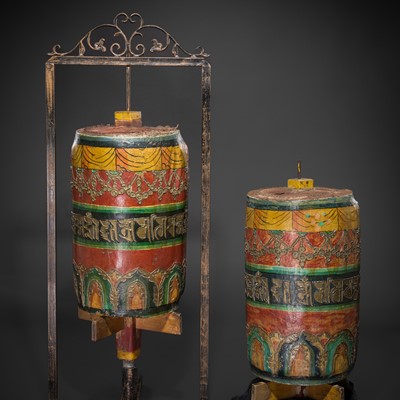 Lot 35 - A PAIR OF MASSIVE LACQUERED PRAYER WHEELS, MANI KORLO, LATE 19TH CENTURY