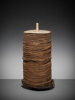 Lot 185 - THE SCRIPTURE CONTENTS OF A LARGE PRAYER WHEEL, TIBET, 19 CENTURY