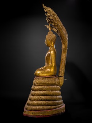 Lot 33 - A MONUMENTAL (194 CM HIGH) GILT-LACQUERED BRONZE FIGURE OF BUDDHA MUCHALINDA, RATTANAKOSIN PERIOD