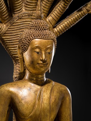 Lot 33 - A MONUMENTAL (194 CM HIGH) GILT-LACQUERED BRONZE FIGURE OF BUDDHA MUCHALINDA, RATTANAKOSIN PERIOD