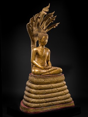 Lot 33 - A MONUMENTAL (194 CM HIGH) GILT-LACQUERED BRONZE FIGURE OF BUDDHA MUCHALINDA, RATTANAKOSIN PERIOD