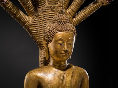 Lot 33 - A MONUMENTAL (194 CM HIGH) GILT-LACQUERED BRONZE FIGURE OF BUDDHA MUCHALINDA, RATTANAKOSIN PERIOD