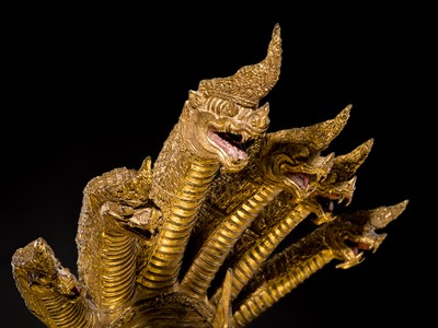 Lot 33 - A MONUMENTAL (194 CM HIGH) GILT-LACQUERED BRONZE FIGURE OF BUDDHA MUCHALINDA, RATTANAKOSIN PERIOD