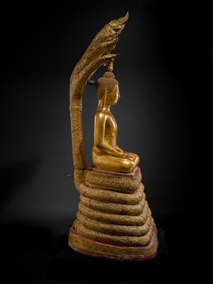 Lot 33 - A MONUMENTAL (194 CM HIGH) GILT-LACQUERED BRONZE FIGURE OF BUDDHA MUCHALINDA, RATTANAKOSIN PERIOD