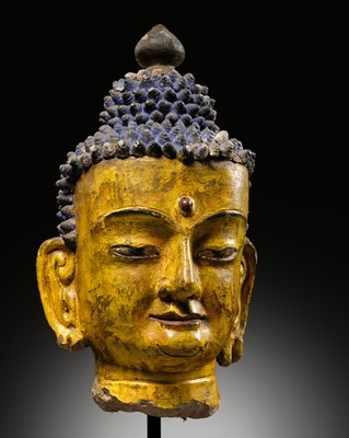 Lot 72 - A LARGE AND IMPRESSIVE POLYCHROME CLAY AND STUCCO HEAD OF BUDDHA, 15TH-16TH CENTURY