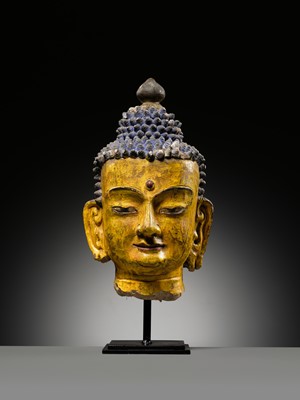 Lot 72 - A LARGE AND IMPRESSIVE POLYCHROME CLAY AND STUCCO HEAD OF BUDDHA, 15TH-16TH CENTURY