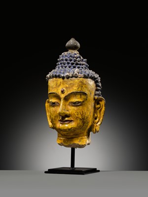 Lot 72 - A LARGE AND IMPRESSIVE POLYCHROME CLAY AND STUCCO HEAD OF BUDDHA, 15TH-16TH CENTURY