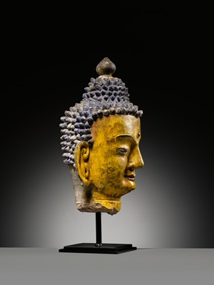 Lot 72 - A LARGE AND IMPRESSIVE POLYCHROME CLAY AND STUCCO HEAD OF BUDDHA, 15TH-16TH CENTURY