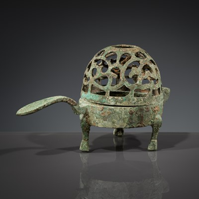 A SMALL BRONZE TRIPOD LAMP WITH A HINGED RETICULATED COVER, HAN DYNASTY